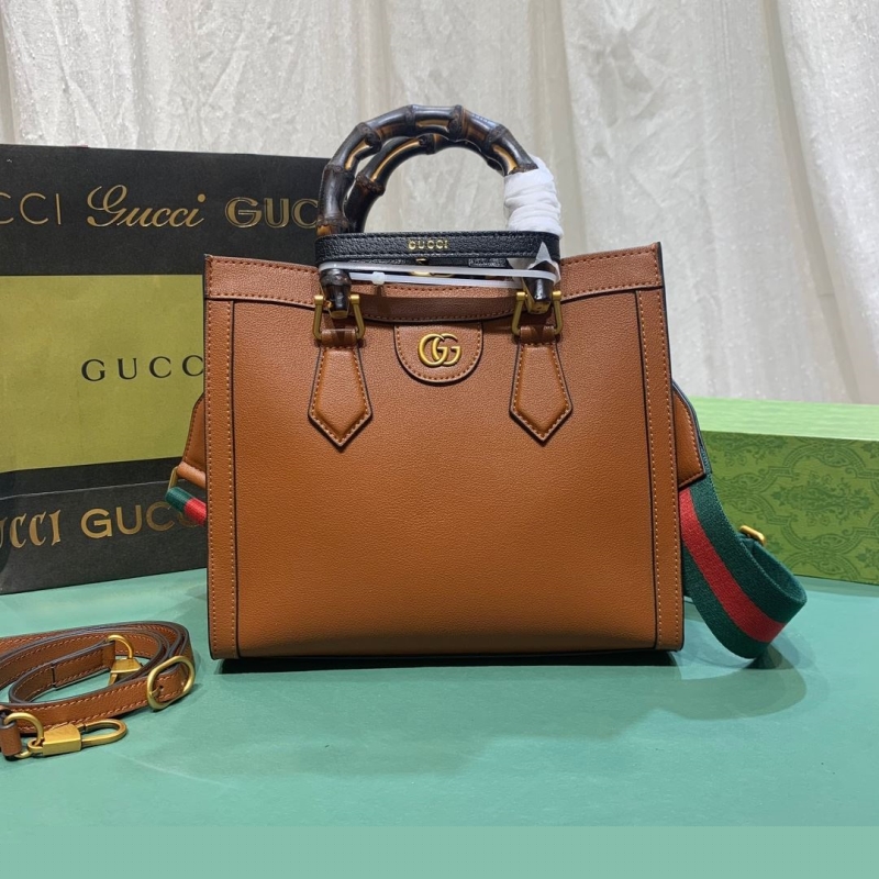 G*u*i top handle bags